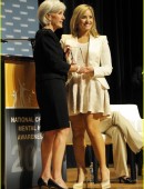 Demi Lovato receives an award from Secretary Kathleen Sebelius in Washington DC