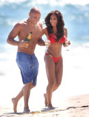 EXCLUSIVE: Mel B pops some champagne on the beach in a bright red birthday bikini in Malibu, CA - Part 1