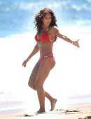 EXCLUSIVE: Mel B pops some champagne on the beach in a bright red birthday bikini in Malibu, CA - Part 1