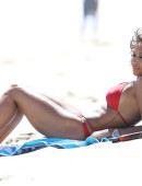 EXCLUSIVE: Mel B pops some champagne on the beach in a bright red birthday bikini in Malibu, CA - Part 1