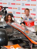 Formula 1 star Jenson Button is joined by TV personality Myleene Klass to pose for pictures with a McClaren car to promote the car manufacturer's sponsor Santander in London