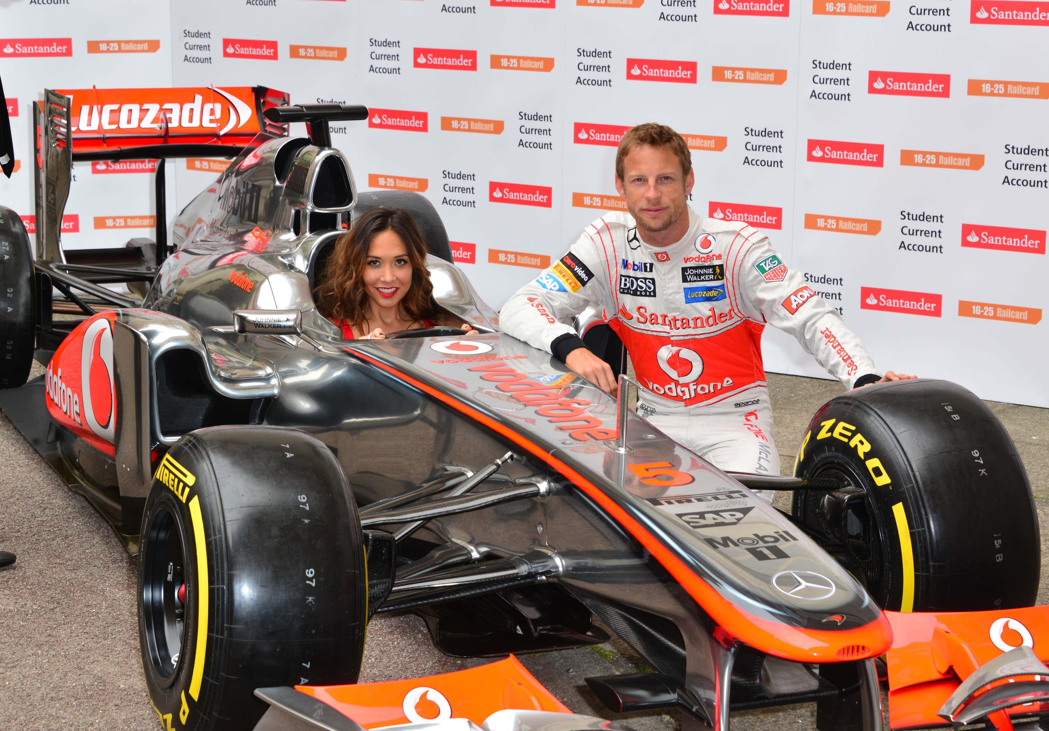 Formula 1 star Jenson Button is joined by TV personality Myleene Klass to pose for pictures with a McClaren car to promote the car manufacturer's sponsor Santander in London