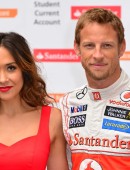 Formula 1 star Jenson Button is joined by TV personality Myleene Klass to pose for pictures with a McClaren car to promote the car manufacturer's sponsor Santander in London