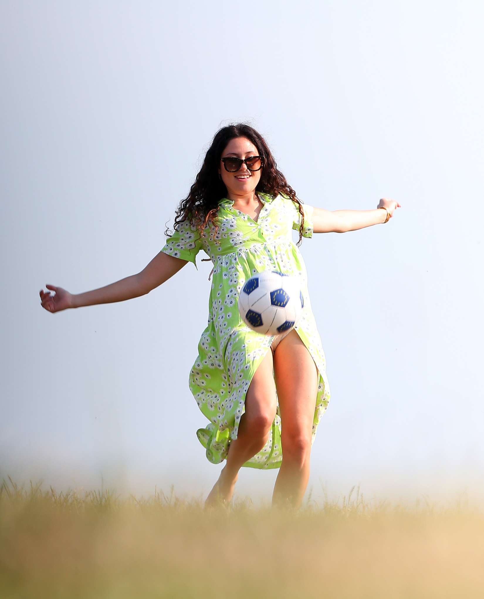 Eliza-Doolittle-Kicking-Ball-in-Green-Dress-in-London-3
