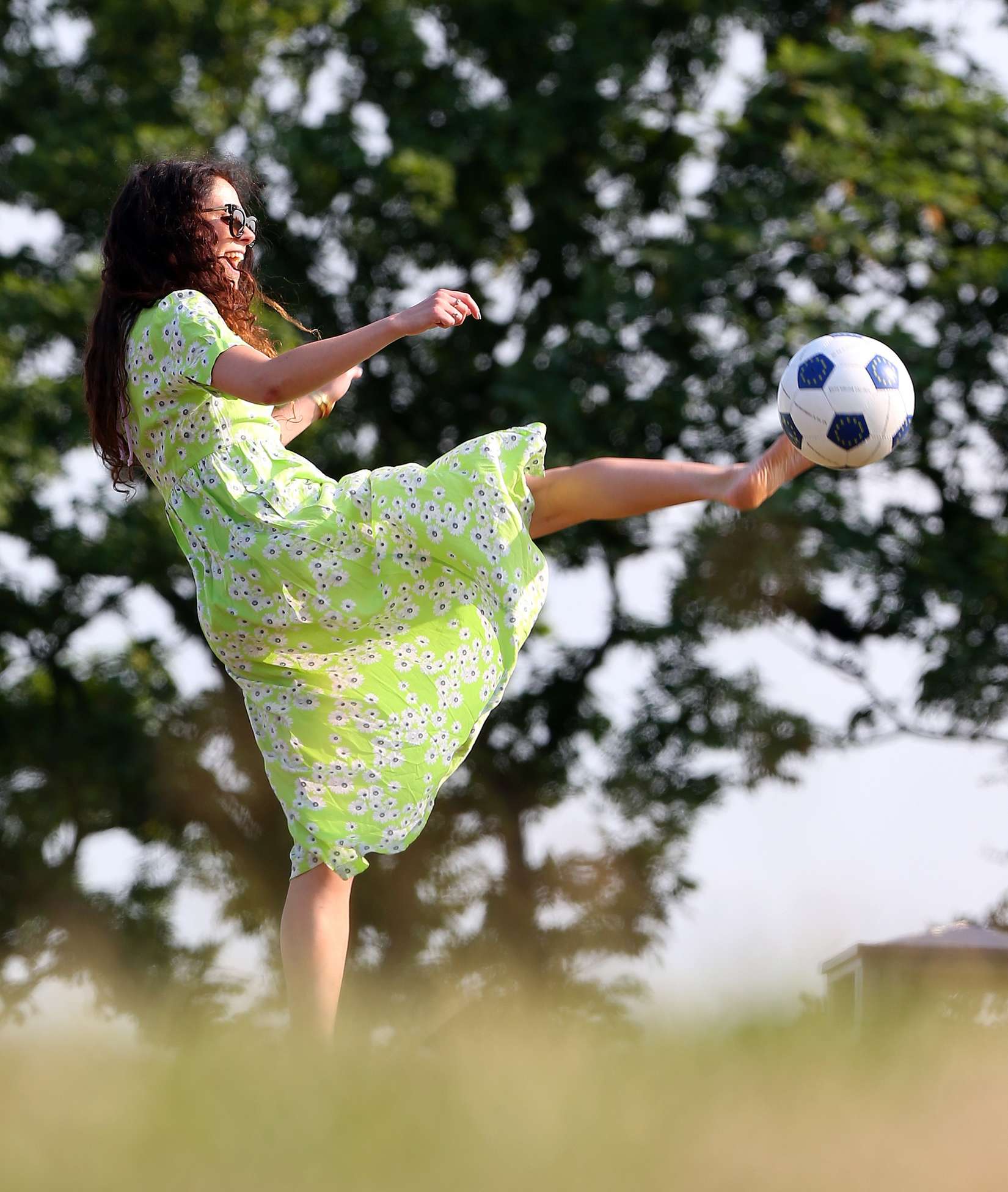 Eliza-Doolittle-Kicking-Ball-in-Green-Dress-in-London-7