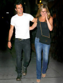 Jennifer Aniston and Justin Theroux show some PDA as they leave dinner in NYC