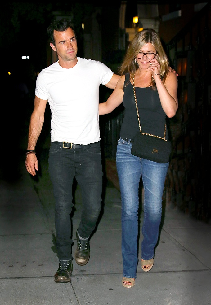 Jennifer Aniston and Justin Theroux show some PDA as they leave dinner in NYC