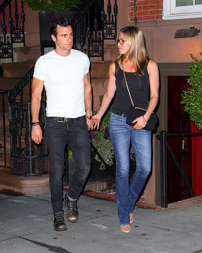 Jennifer Aniston and Justin Theroux show some PDA as they leave dinner in NYC