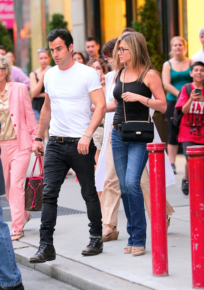 Jennifer Aniston and Justin Theroux show some PDA as they leave dinner in NYC