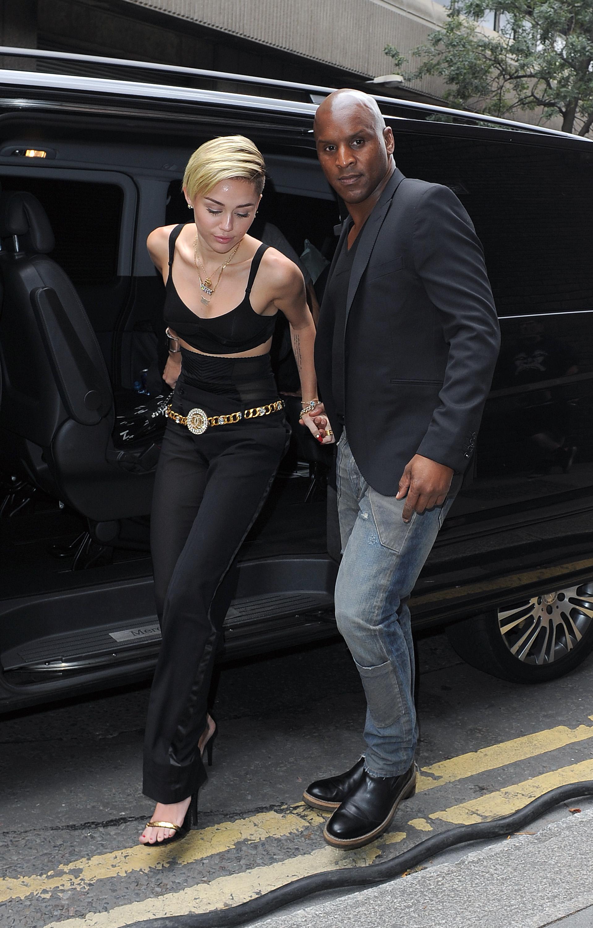 Miley Cyrus arriving at an office building