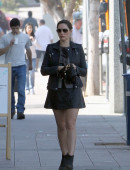 EXCLUSIVE: Kelly Brook shows off her legs in a black mini skirt as she walks around in LA
