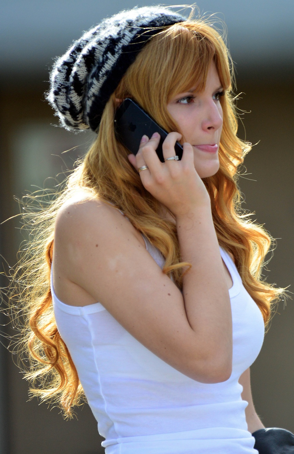 EXCLUSIVE: Actress Bella Thorne looking fashionable in a beanie, white t-shirt and jeans as she waits for some friends while out and about in Studio City, CA