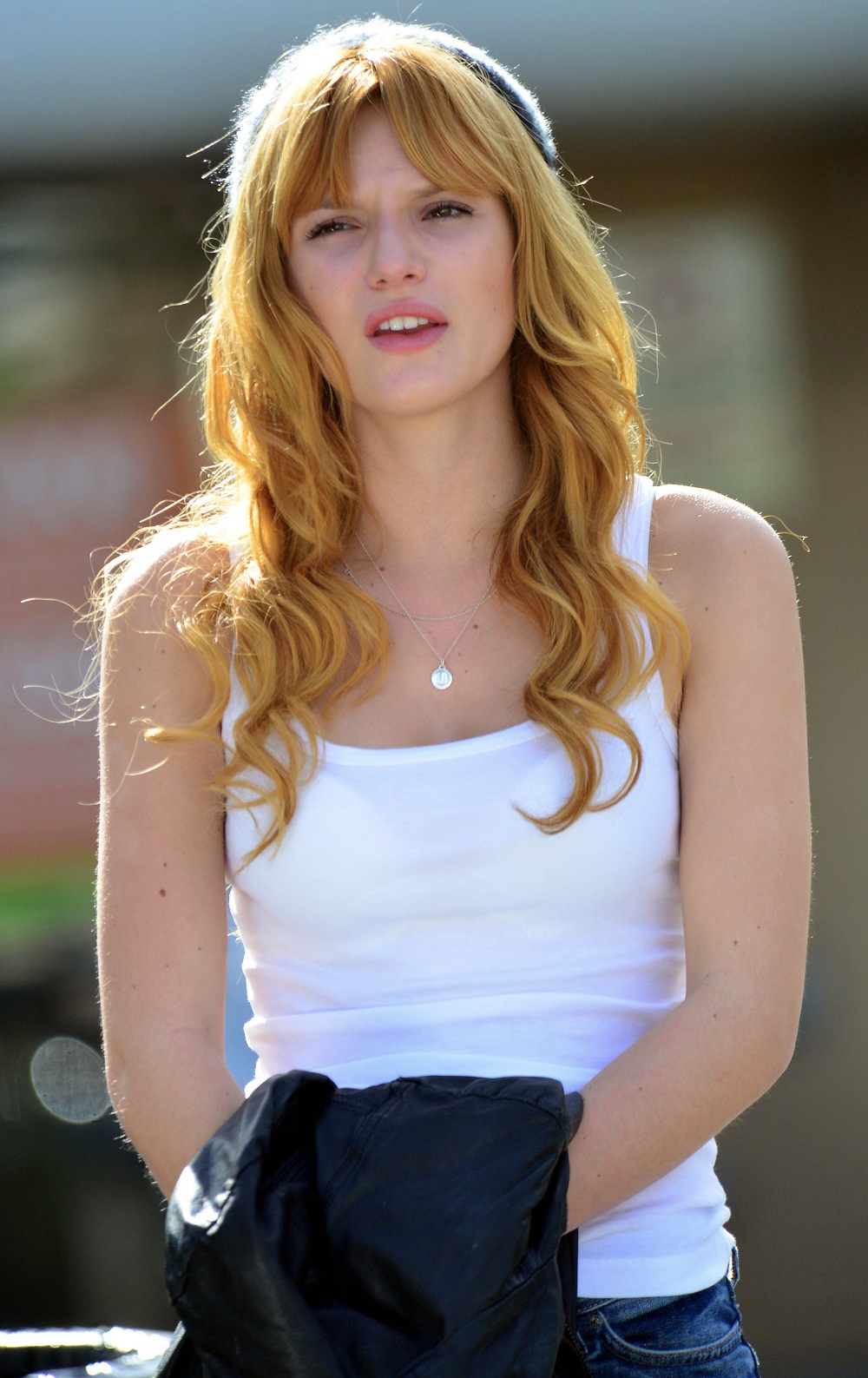 EXCLUSIVE: Actress Bella Thorne looking fashionable in a beanie, white t-shirt and jeans as she waits for some friends while out and about in Studio City, CA