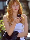 EXCLUSIVE: Actress Bella Thorne looking fashionable in a beanie, white t-shirt and jeans as she waits for some friends while out and about in Studio City, CA