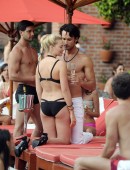 EXCLUSIVE: Margot Robbie films romantic pool-side scene with hunky Brazilian co-star Rodrigo Santoro
