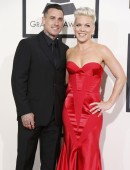 Pink arrives with her husband Carey Hart at the 56th annual Grammy Awards in Los Angeles