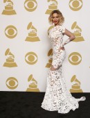 Beyonce poses backstage after performing at the 56th annual Grammy Awards in Los Angeles