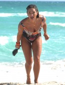 International fitness model Jennifer Nicole Lee hits the beach in a sexy one piece tiger swimsuit and shows off her inner tiger spirit at Miami Beach