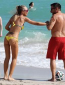 Laura Cremaschi and boyfriend Andrea Perone playing soccer on the beach in Miami