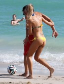 Laura Cremaschi and boyfriend Andrea Perone playing soccer on the beach in Miami