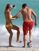Laura Cremaschi and boyfriend Andrea Perone playing soccer on the beach in Miami