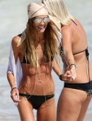 Sharni Vinson takes Willow Ann, a friends toddler, to the beach at Cronulla
