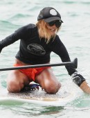 Sharni Vinson and family seen paddle boarding and having fun in water at Cronulla Beach in Sydney