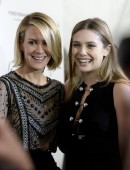 Elizabeth Olsen and Sarah Paulson pose at the premiere of "In Secret" in Los Angeles