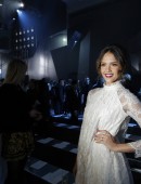 Actress Jessica Alba poses for photographers before H&M's Fall/Winter 2014-2015 women's ready-to-wear collection during Paris Fashion Week