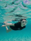 Miranda-Cosgrove-Oceana-Swimming-with-Dolphins-Campaign-5