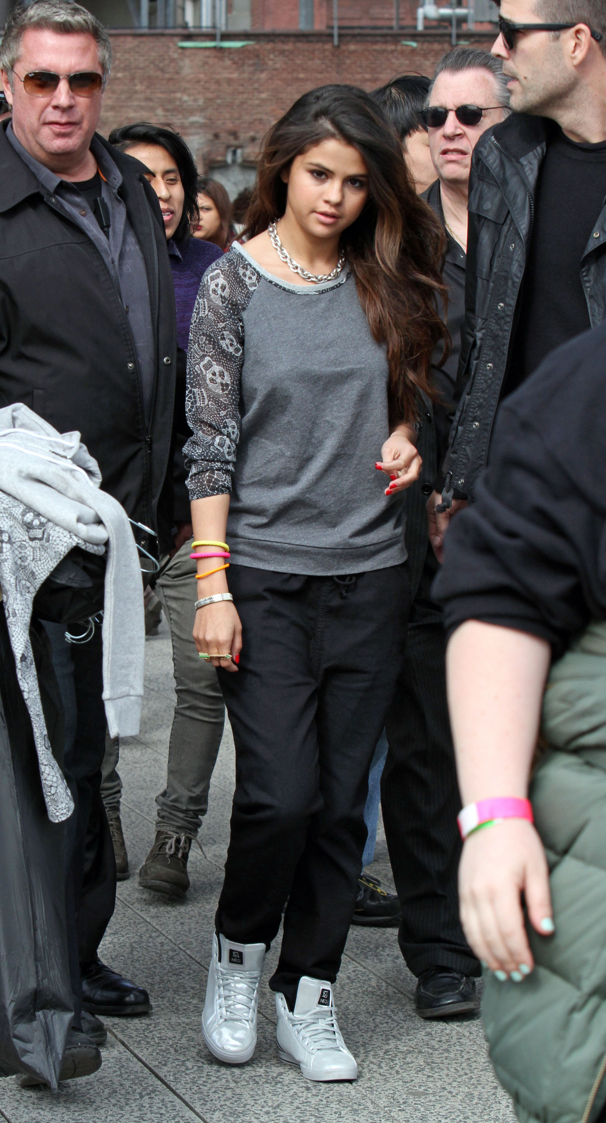Selena Gomez has a large group of bodyguards surround her while she does a photoshoot at the 'Highline' in the Meatpacking District