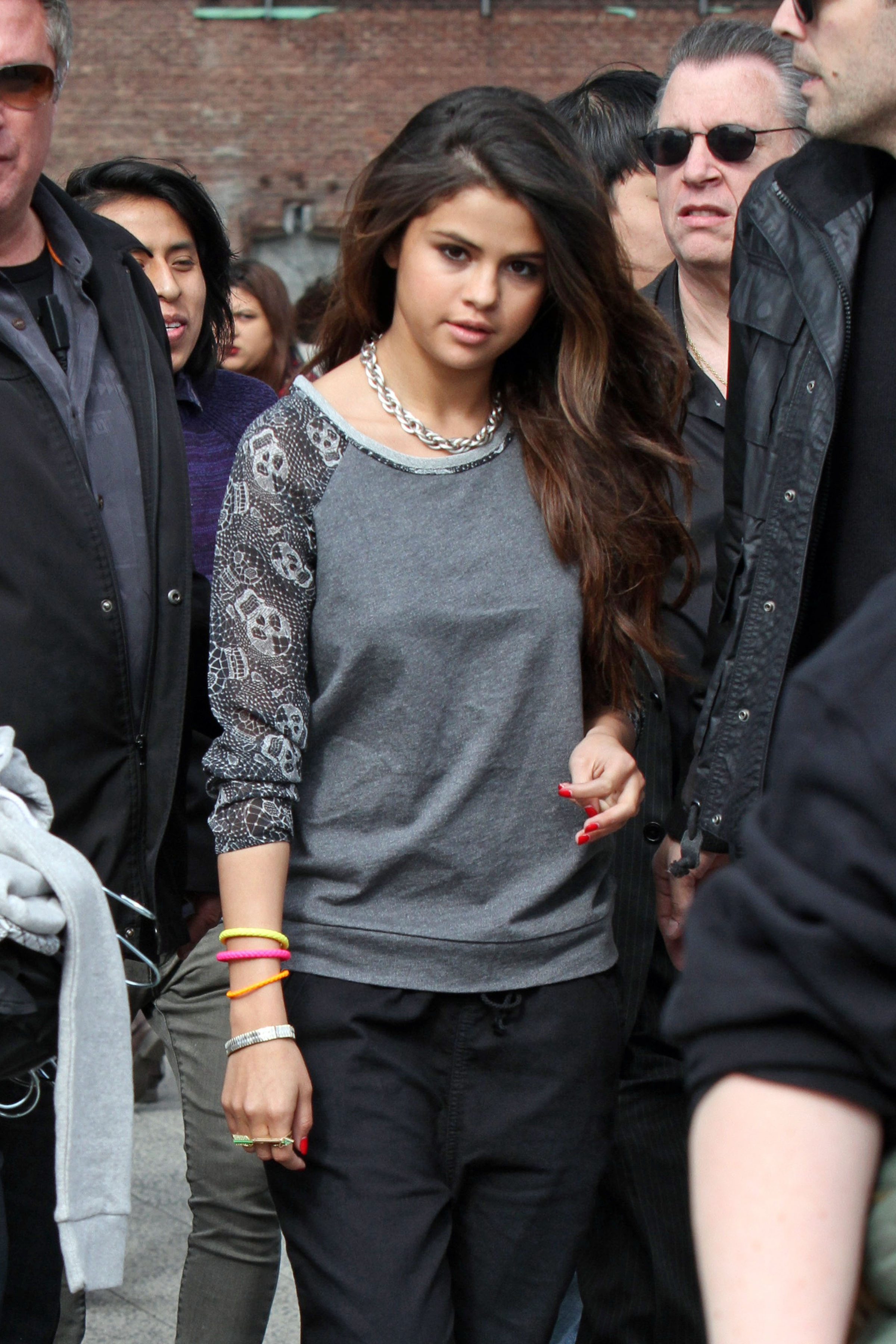 Selena Gomez has a large group of bodyguards surround her while she does a photoshoot at the 'Highline' in the Meatpacking District