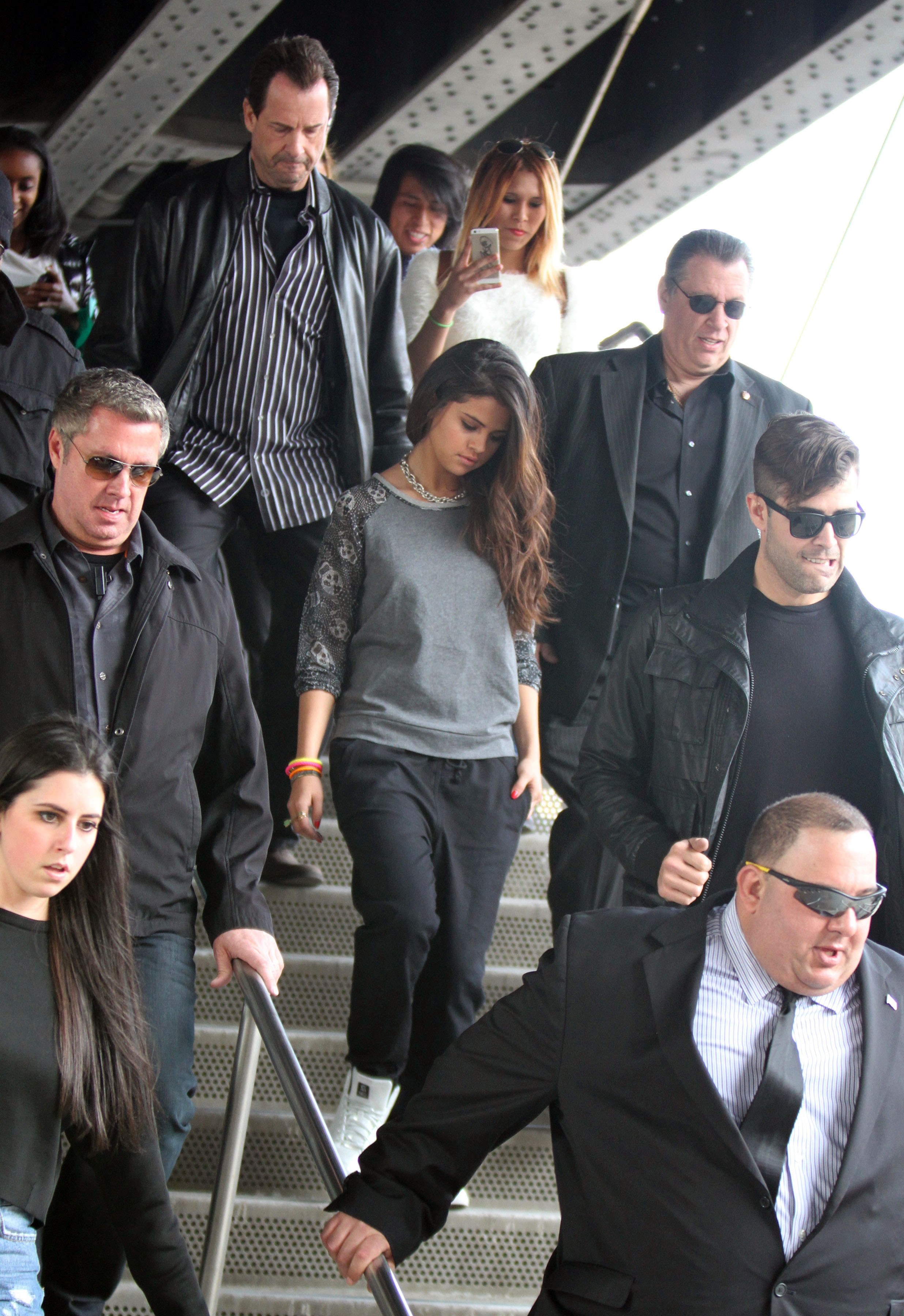 Selena Gomez has a large group of bodyguards surround her while she does a photoshoot at the 'Highline' in the Meatpacking District