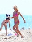 Model Victoria Silvstedt seen wearing a pink bikini as she enjoys and relaxes in the sun at Miami Beach