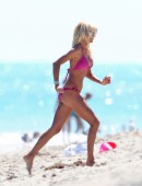 Model Victoria Silvstedt seen wearing a pink bikini as she enjoys and relaxes in the sun at Miami Beach