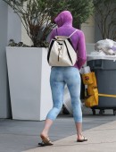 Anne Hathaway showing off butt in sky-colored yoga pants
