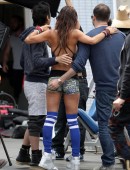 Brooke Burke-Charvet shows off her toned figure while shooting a new Sketchers advertisement at an outdoor gym in Los Angeles