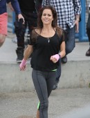 Brooke Burke-Charvet shows off her toned figure while shooting a new Sketchers advertisement at an outdoor gym in Los Angeles