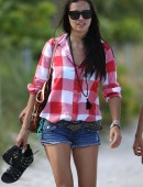 Newly single Adriana Lima shows off her long legs as she spends the afternoon with friends on Miami Beach