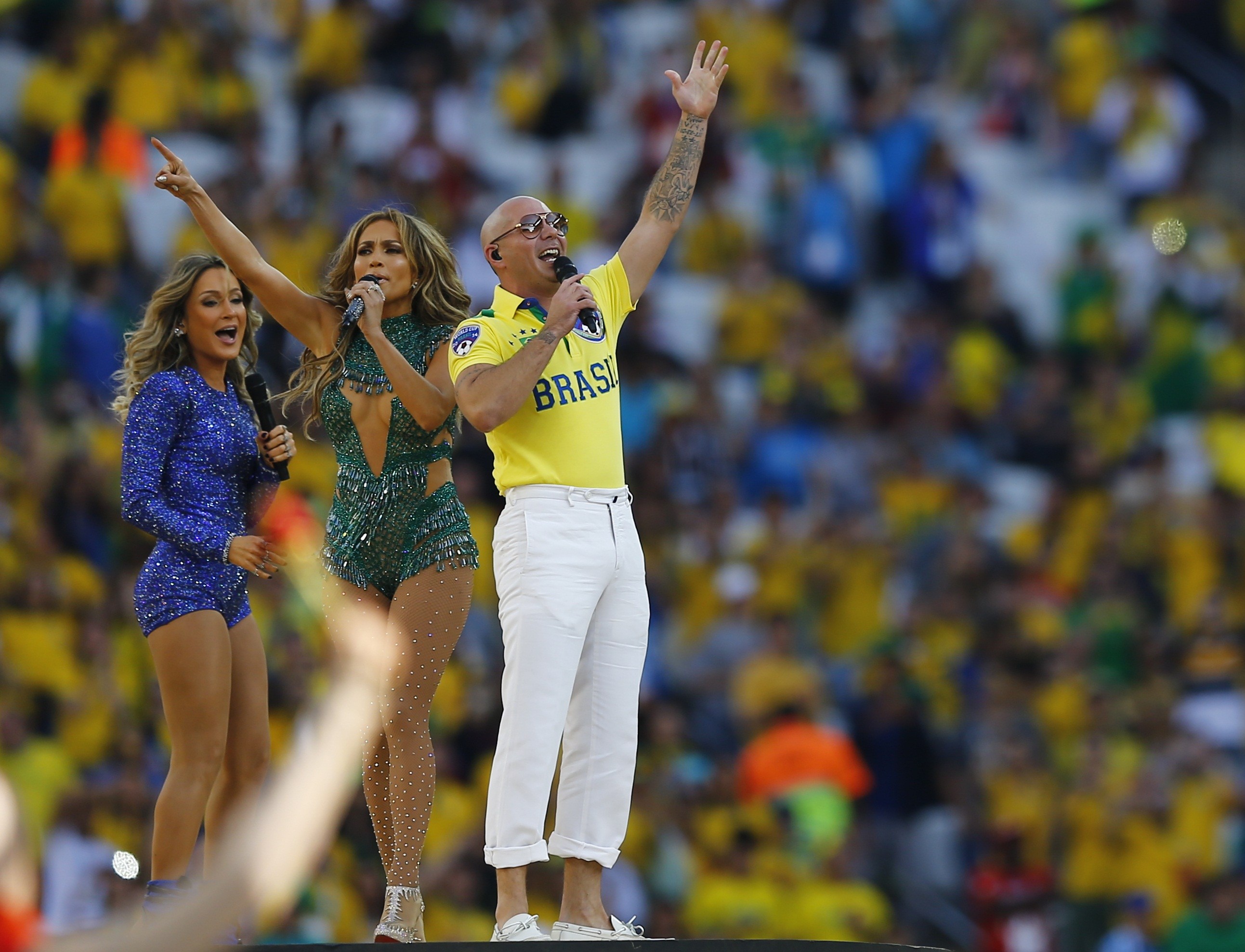 Singers Pitbull, Jennifer Lopez and Claudia Leitte perform during the 2014 World Cup opening ceremony at the Corinthians arena in Sao Paulo