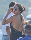 Cara Delevigne And Selena Gomez are seen leaving their yacht and boarding a tender into st tropez, selena was seen dancing and singing in a black cocktail dress, the girls took a trip to Dior to try on dresses ahead of the leonardo dicaprio's party tonigh