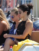 Cara Delevigne And Selena Gomez are seen leaving their yacht and boarding a tender into st tropez, selena was seen dancing and singing in a black cocktail dress, the girls took a trip to Dior to try on dresses ahead of the leonardo dicaprio's party tonigh