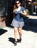Kelly Brook wears a short skirt and a semi-sheer top as she runs errands in LA