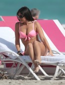 Italian model Claudia Romani wears a pink bikini to the beach in Miami