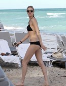 EXCLUSIVE: Whitney Port wears a black bikini to the beach with her fiance Tim Rosenman in Miami