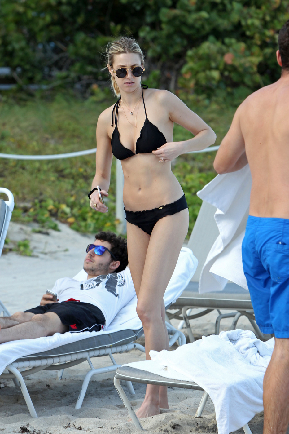 EXCLUSIVE: Whitney Port wears a black bikini to the beach with her fiance Tim Rosenman in Miami