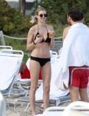 EXCLUSIVE: Whitney Port wears a black bikini to the beach with her fiance Tim Rosenman in Miami