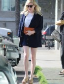 Kirsten-Dunst-Leggy-in-Skirt-11