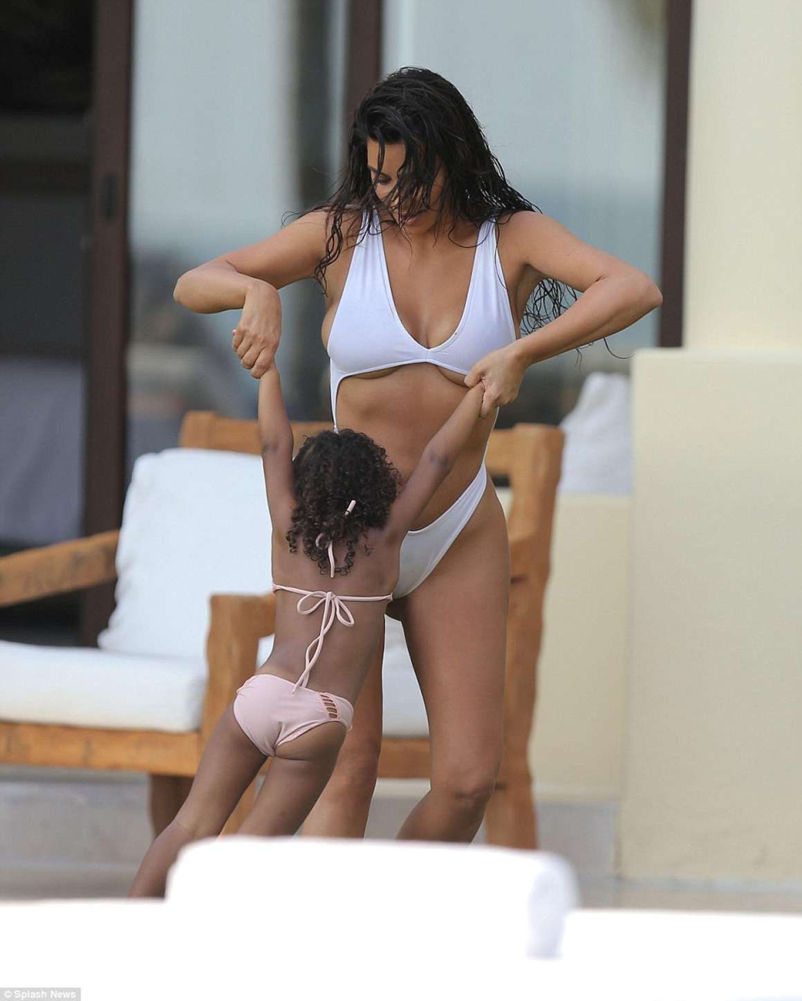 Kim-Kardashian-in-White-Swimsuit-10