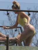 Khloe-Kardashian-in-Yellow-Swimsuit-8
